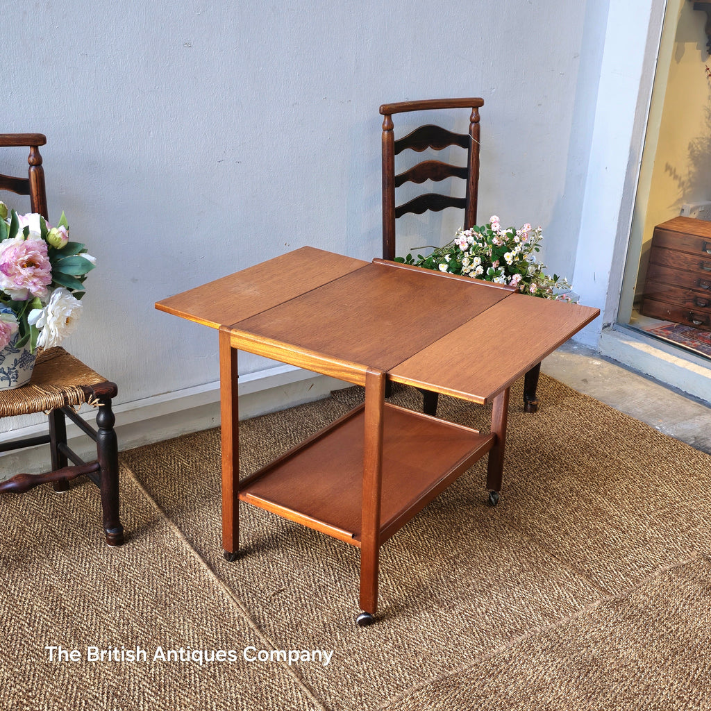 Mid-century drop leaf trolley table on casters wheel