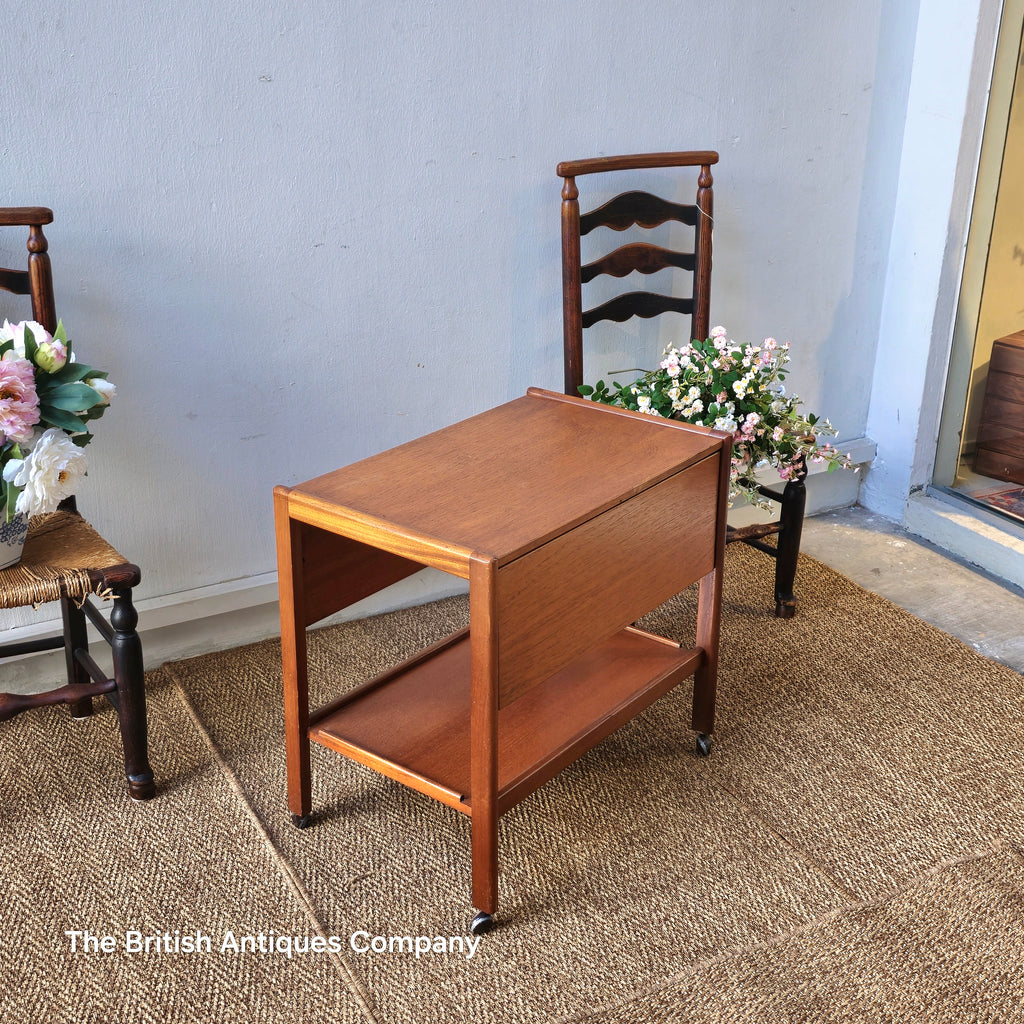 Mid-century drop leaf trolley table on casters wheel
