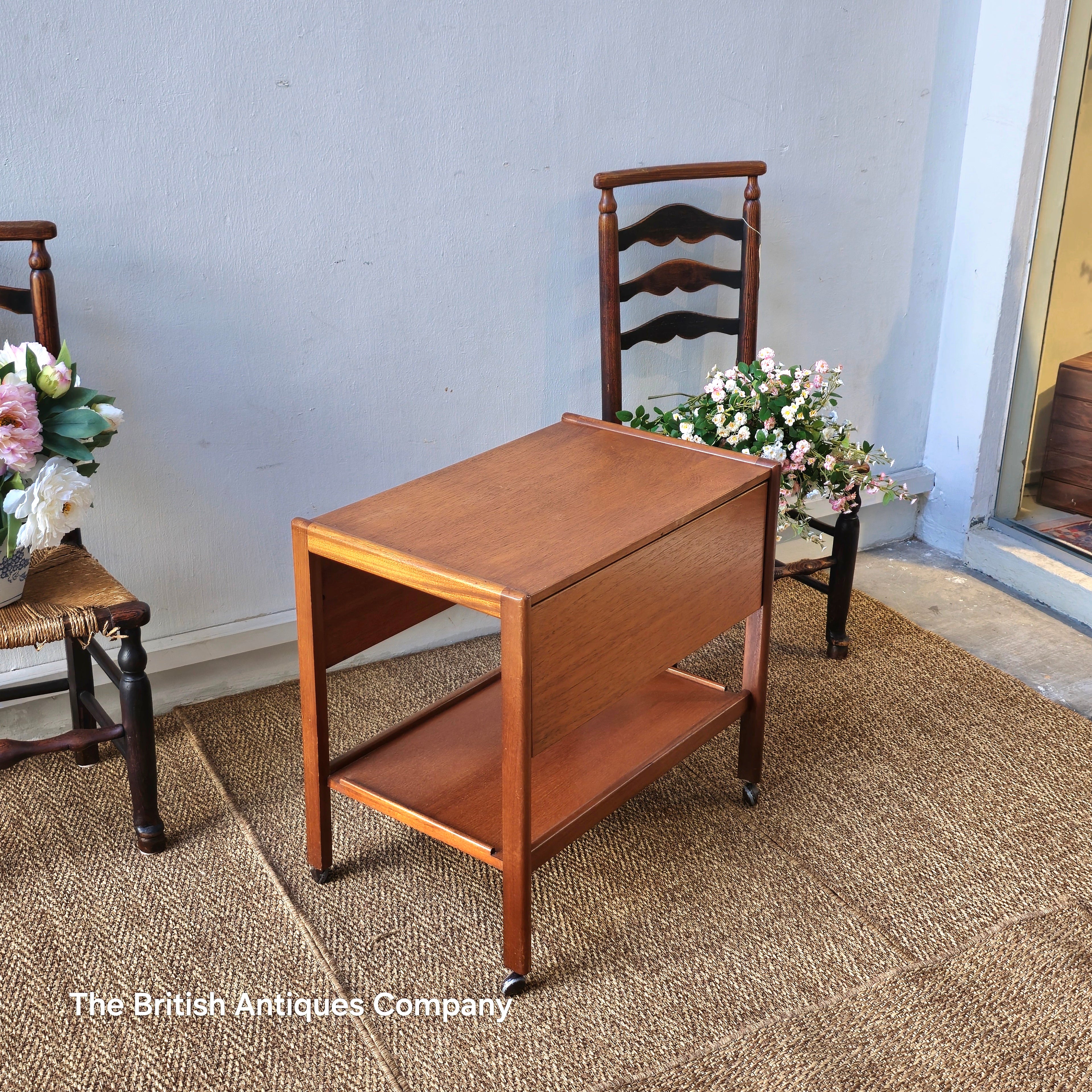 Mid-century drop leaf trolley table on casters wheel
