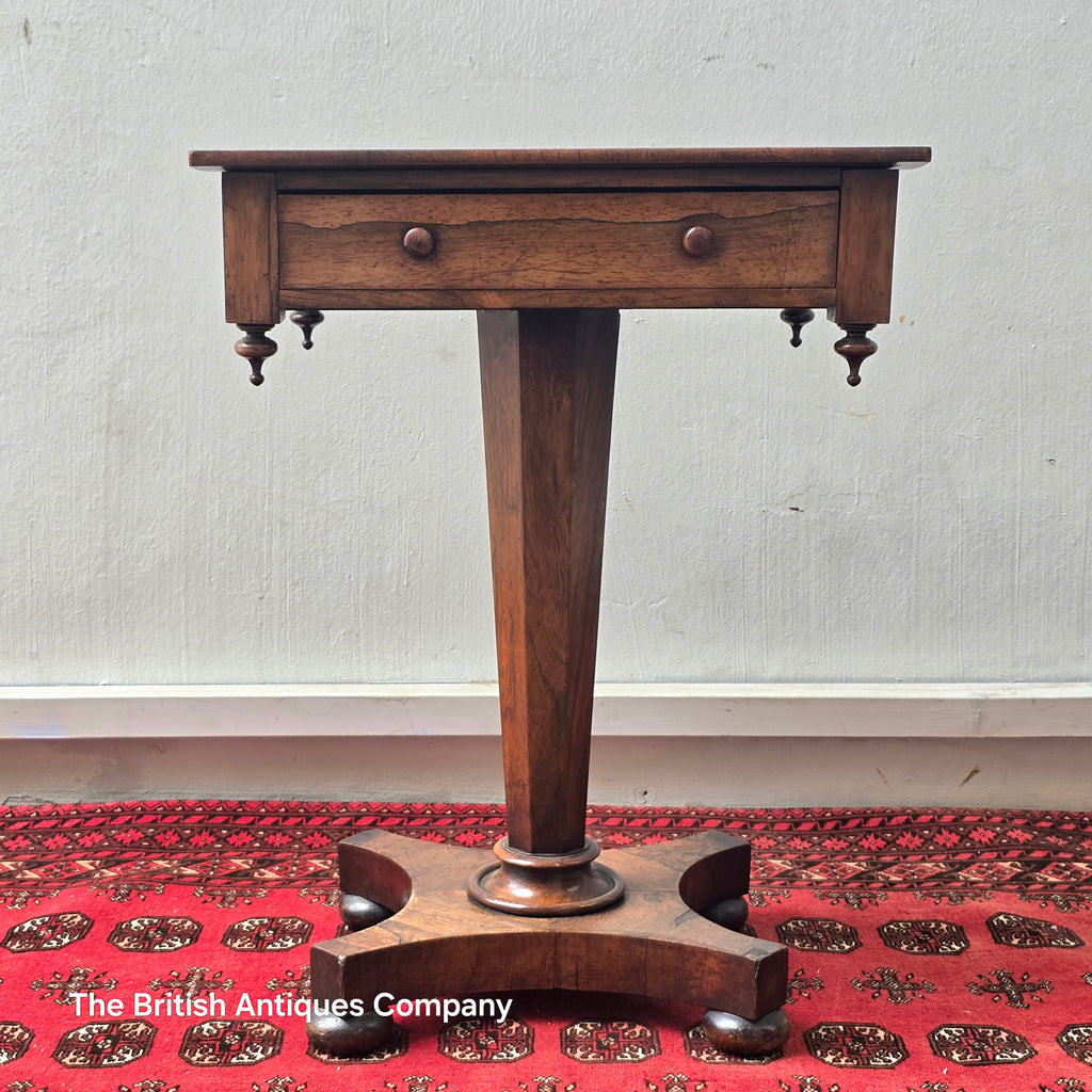 A VICTORIAN ROSEWOOD PEDESTAL CENTRE TABLE WITH SINGLE DRAWER ON BUN FEET, 21.5" X 17"