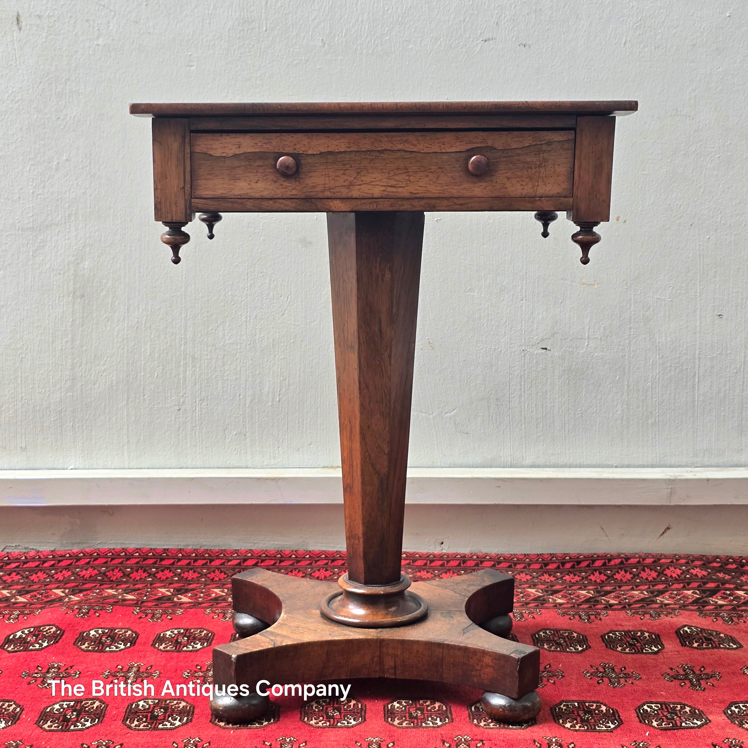 A VICTORIAN ROSEWOOD PEDESTAL CENTRE TABLE WITH SINGLE DRAWER ON BUN FEET, 21.5" X 17"
