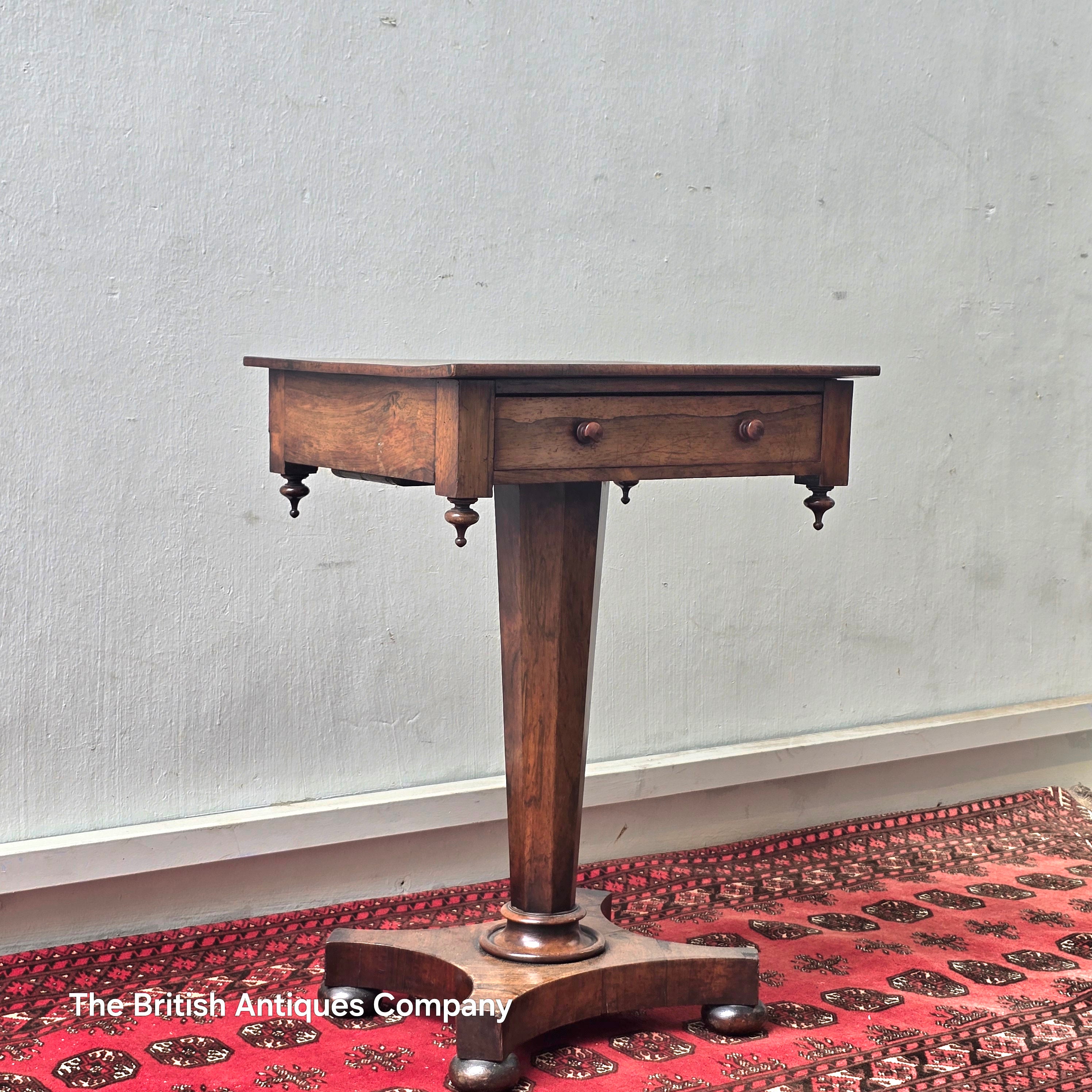 A VICTORIAN ROSEWOOD PEDESTAL CENTRE TABLE WITH SINGLE DRAWER ON BUN FEET, 21.5" X 17"