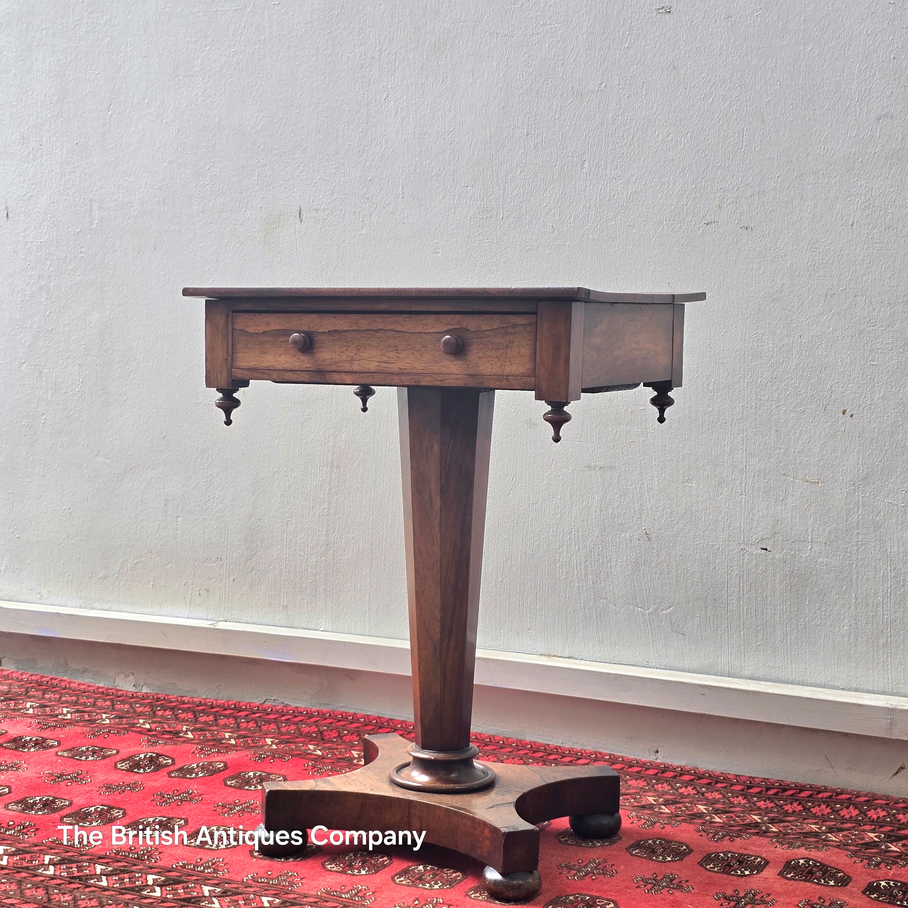 A VICTORIAN ROSEWOOD PEDESTAL CENTRE TABLE WITH SINGLE DRAWER ON BUN FEET, 21.5" X 17"
