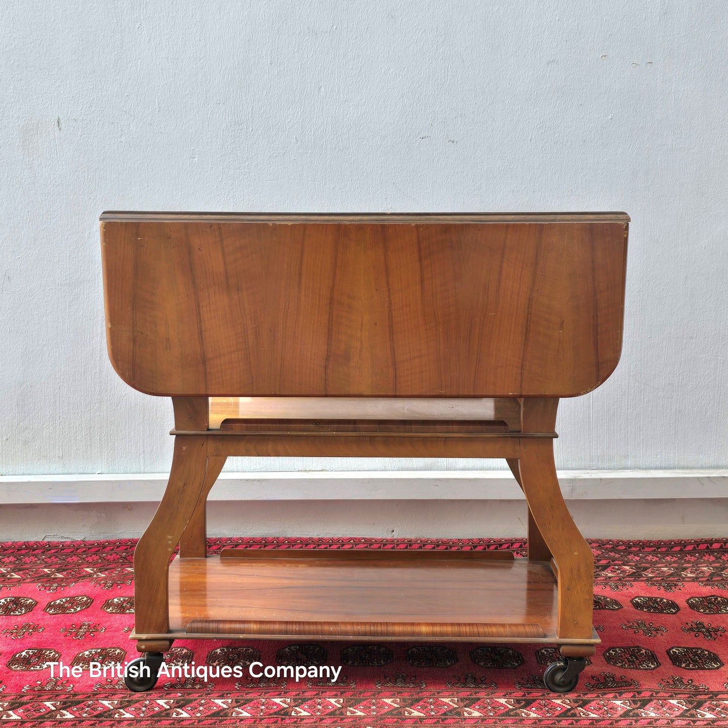 MID 20TH CENTURY WALNUT THREE TIER DROP LEAF TROLLEY BEARING TENAX FREELAND (MANCHESTER) LABEL