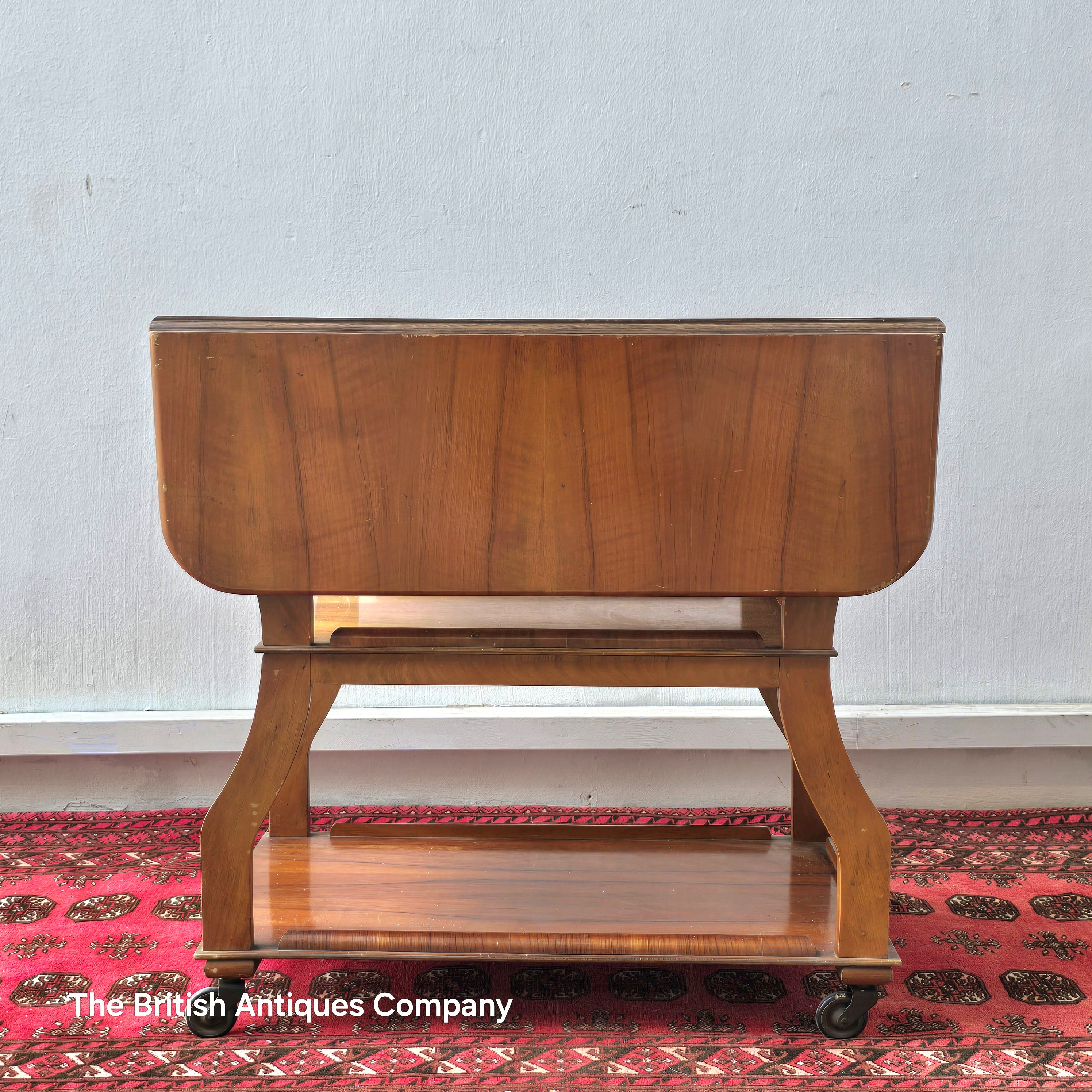 MID 20TH CENTURY WALNUT THREE TIER DROP LEAF TROLLEY BEARING TENAX FREELAND (MANCHESTER) LABEL