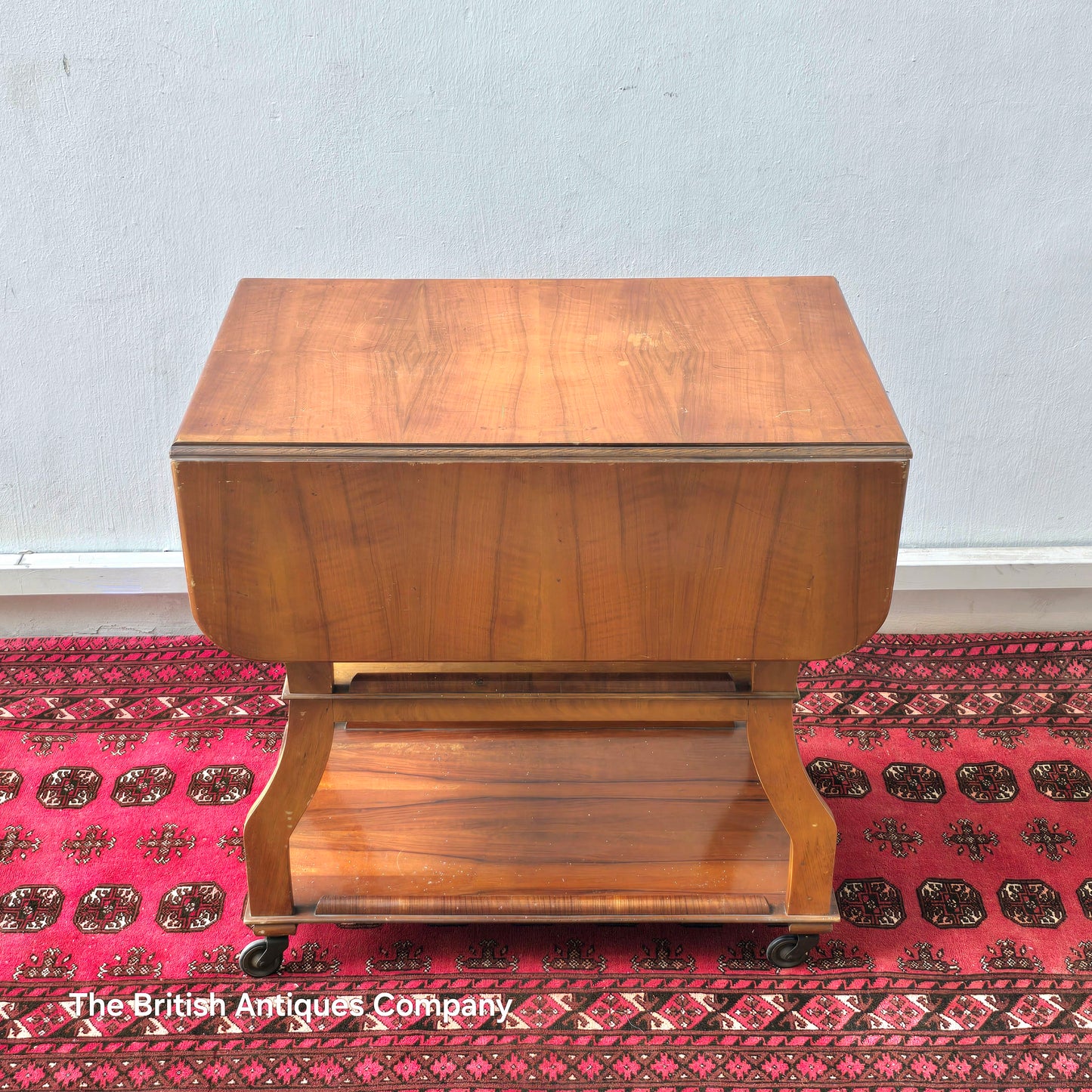 MID 20TH CENTURY WALNUT THREE TIER DROP LEAF TROLLEY BEARING TENAX FREELAND (MANCHESTER) LABEL