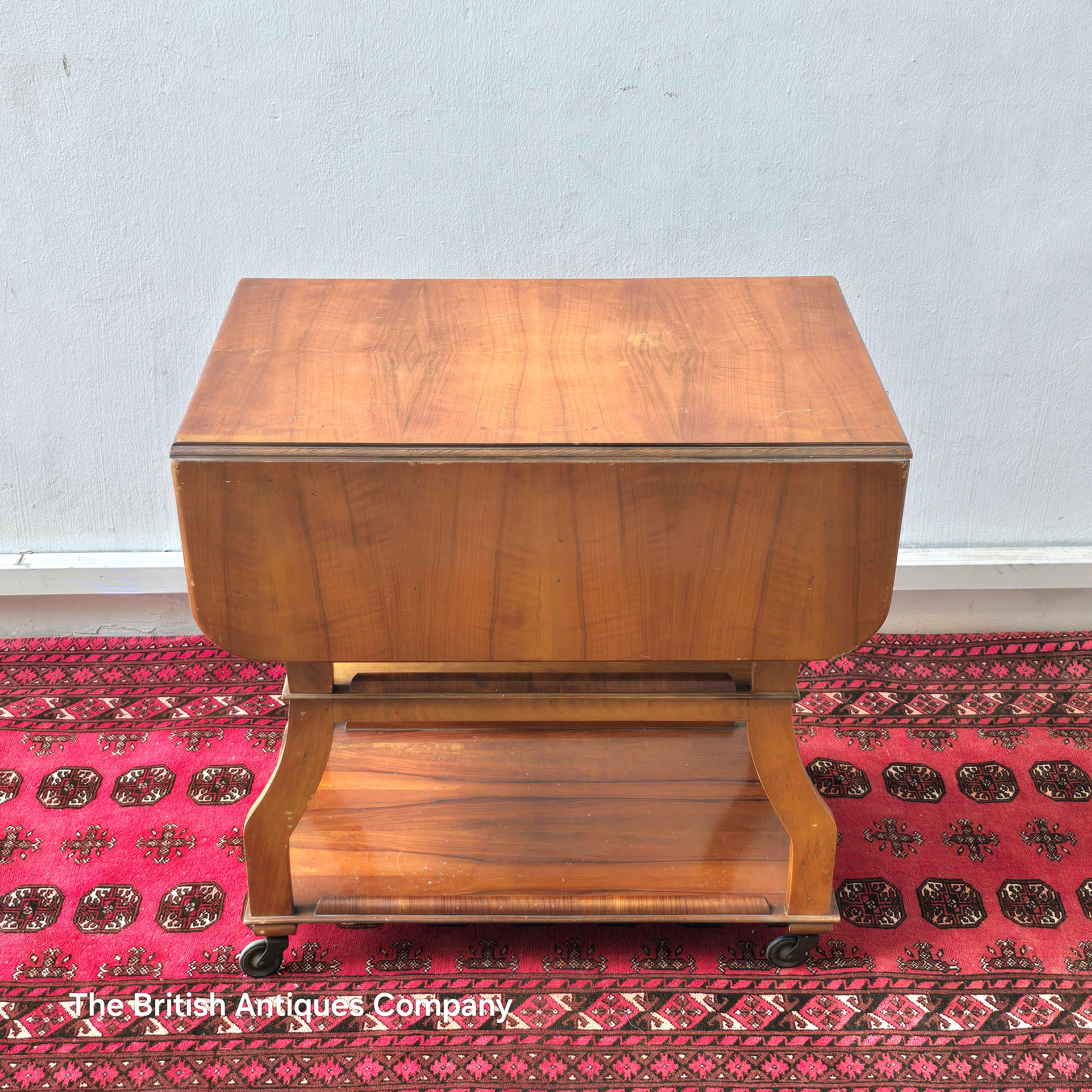 MID 20TH CENTURY WALNUT THREE TIER DROP LEAF TROLLEY BEARING TENAX FREELAND (MANCHESTER) LABEL