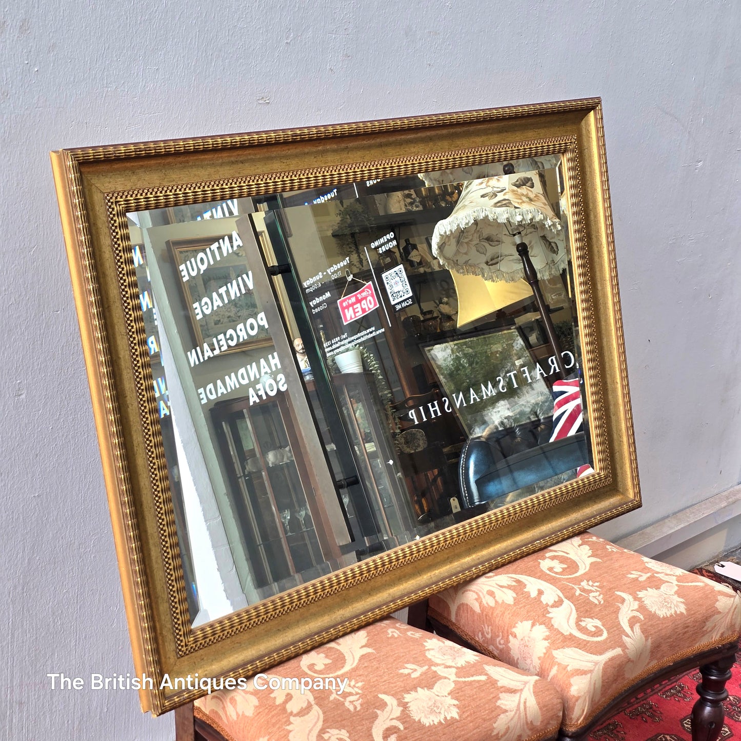 A VINTAGE GILT FRAMED WALL MIRROR WITH BEVEL EDGE, 43" X 33"