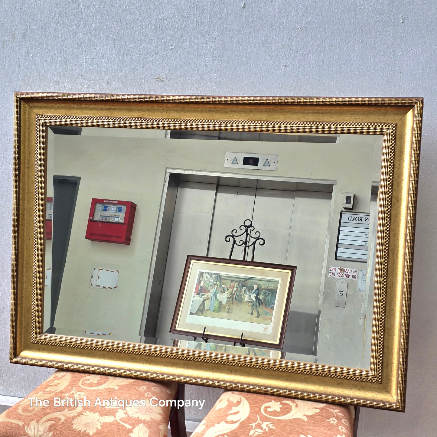 A VINTAGE GILT FRAMED WALL MIRROR WITH BEVEL EDGE, 43" X 33"