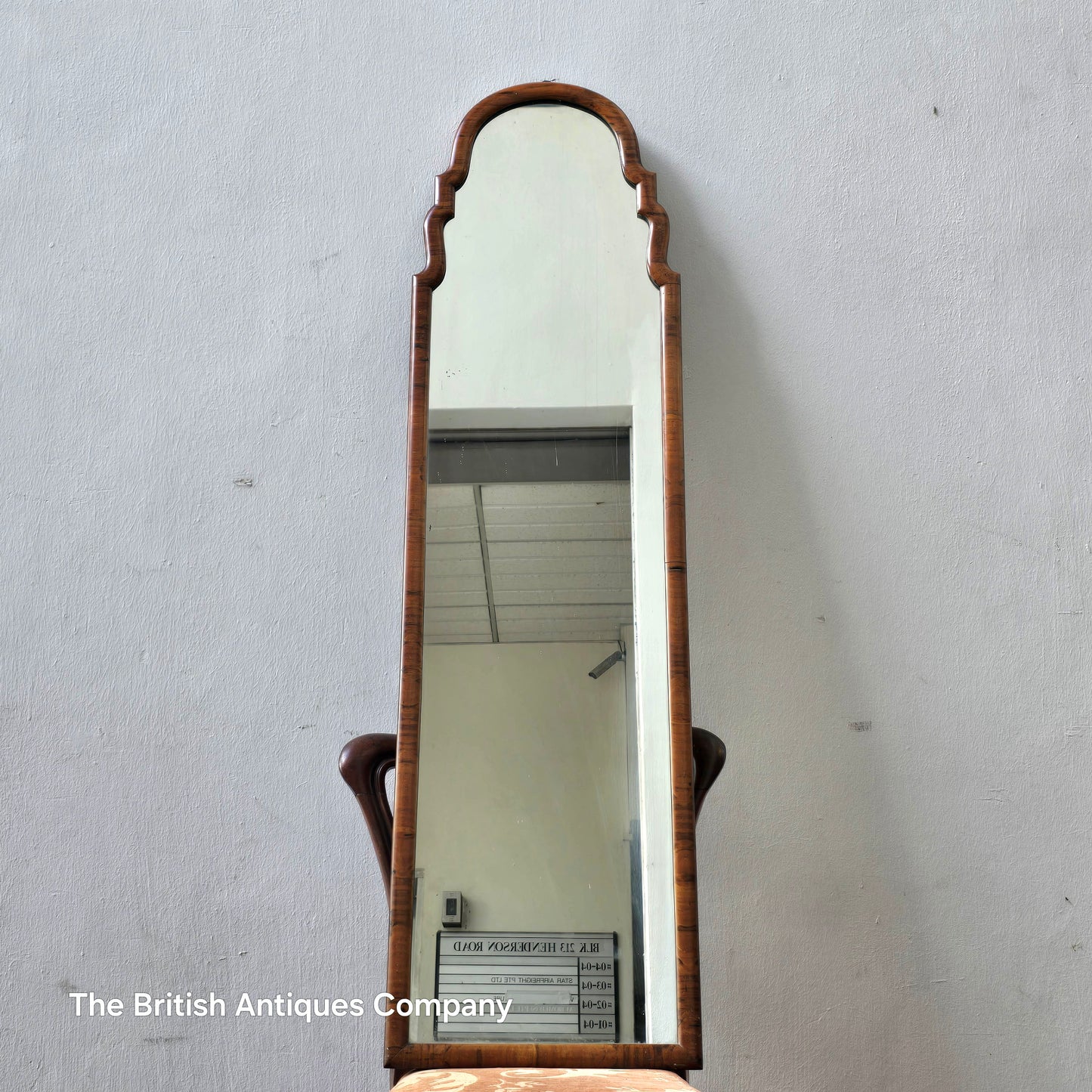 A MID 20TH CENTURY WALNUT MIRROR, 50" X 14"