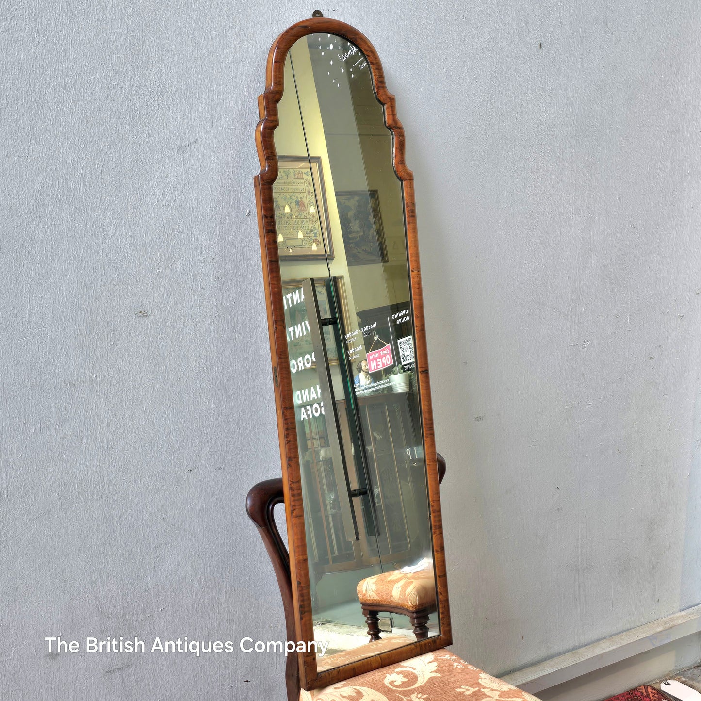A MID 20TH CENTURY WALNUT MIRROR, 50" X 14"