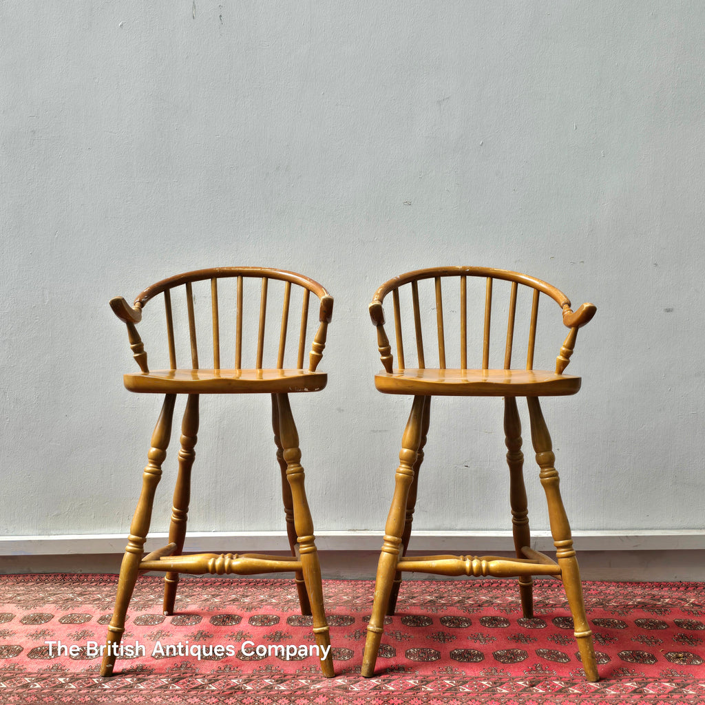 A PAIR OF HARDWOOD HIGH BACK KITCHEN STOOLS ON TURNED LEGS AND STRECHERS