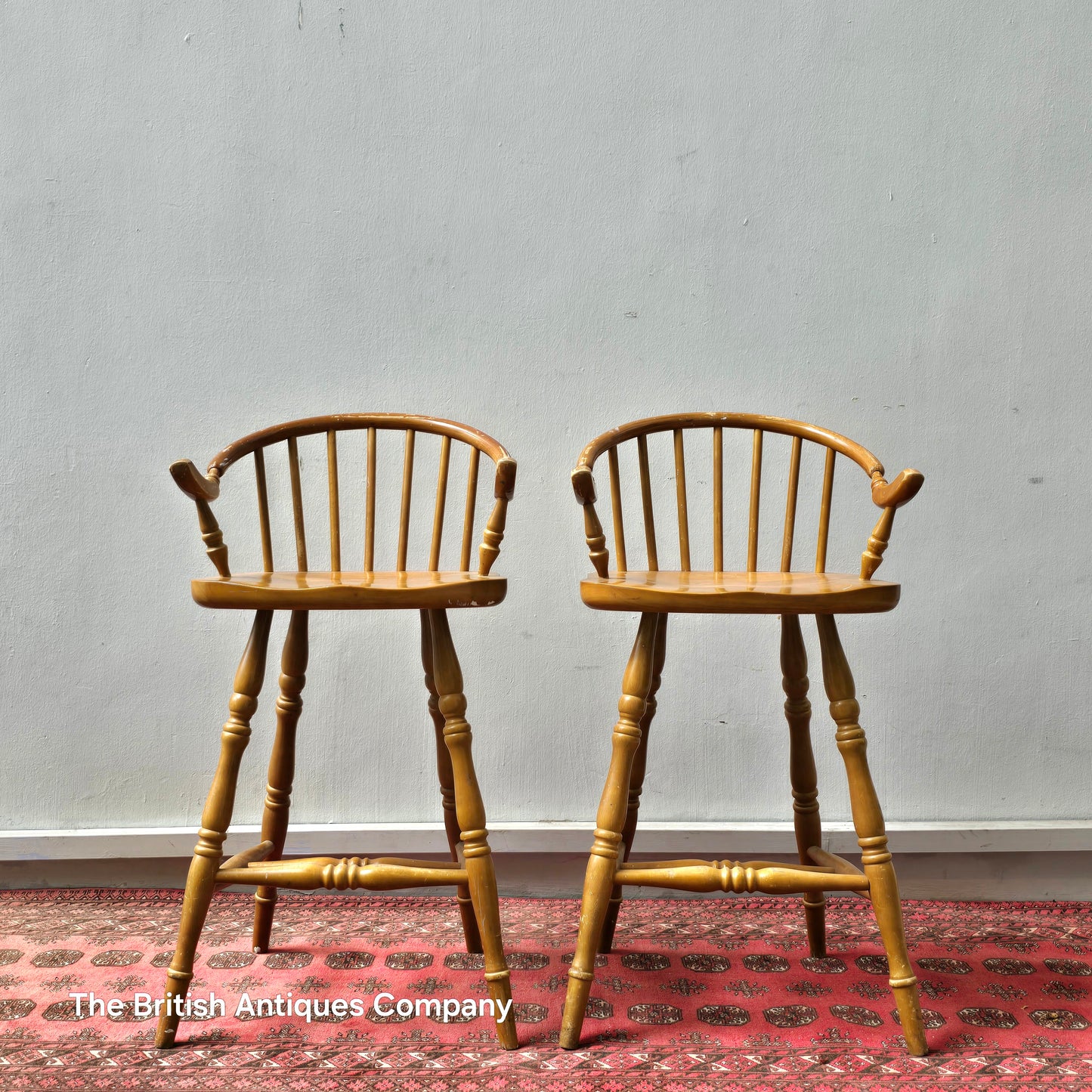 A PAIR OF HARDWOOD HIGH BACK KITCHEN STOOLS ON TURNED LEGS AND STRECHERS