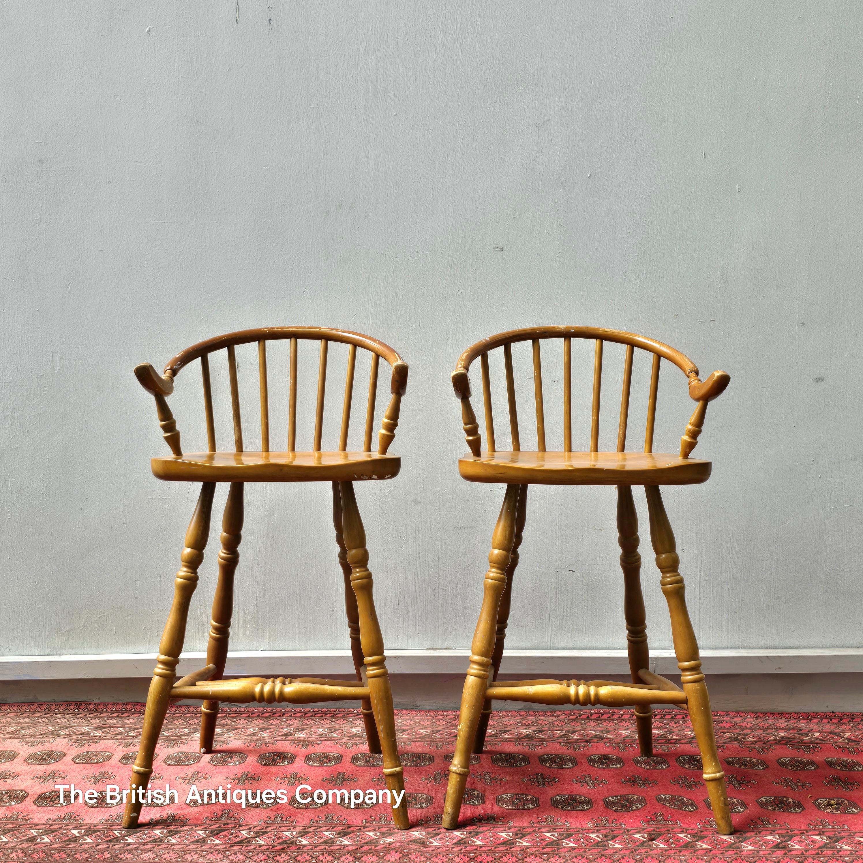 A PAIR OF HARDWOOD HIGH BACK KITCHEN STOOLS ON TURNED LEGS AND STRECHERS