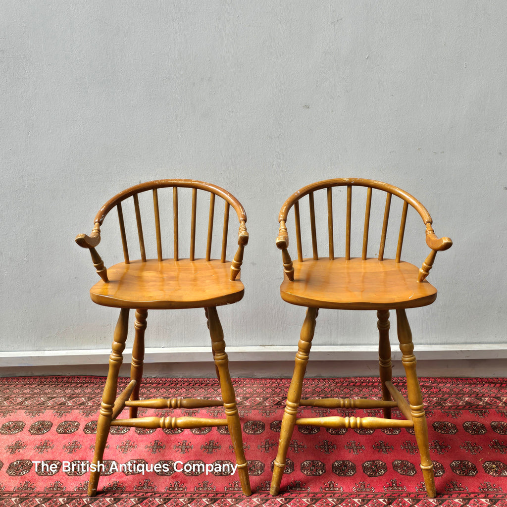 A PAIR OF HARDWOOD HIGH BACK KITCHEN STOOLS ON TURNED LEGS AND STRECHERS