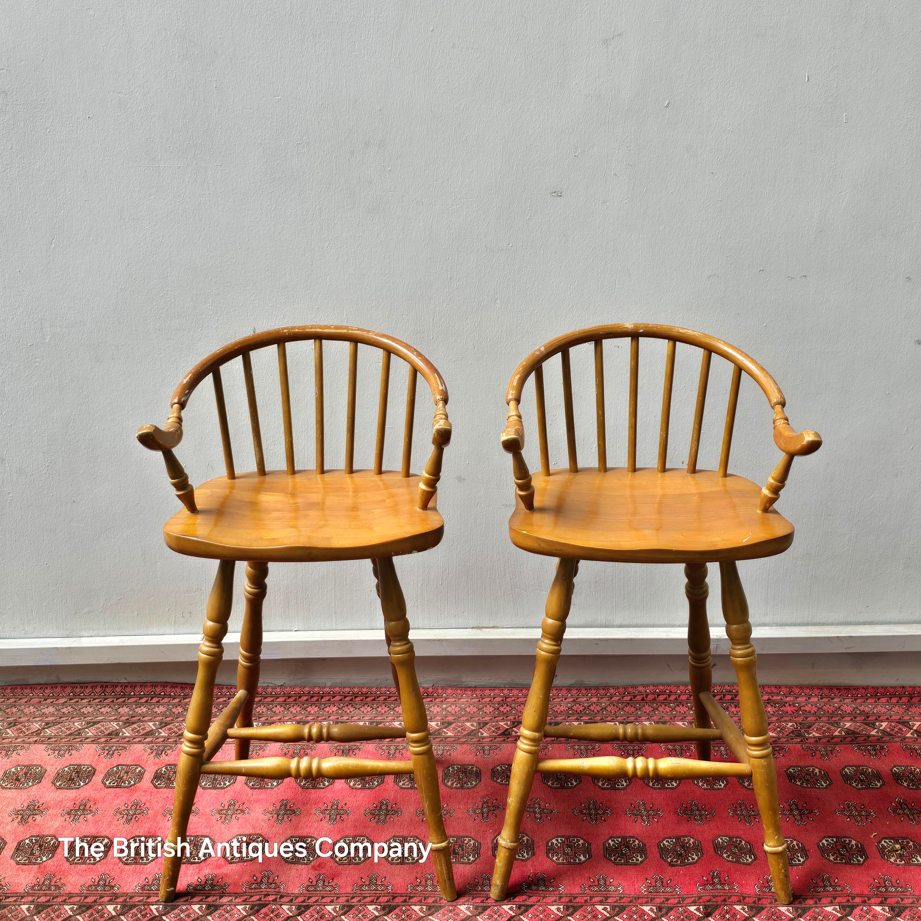 A PAIR OF HARDWOOD HIGH BACK KITCHEN STOOLS ON TURNED LEGS AND STRECHERS