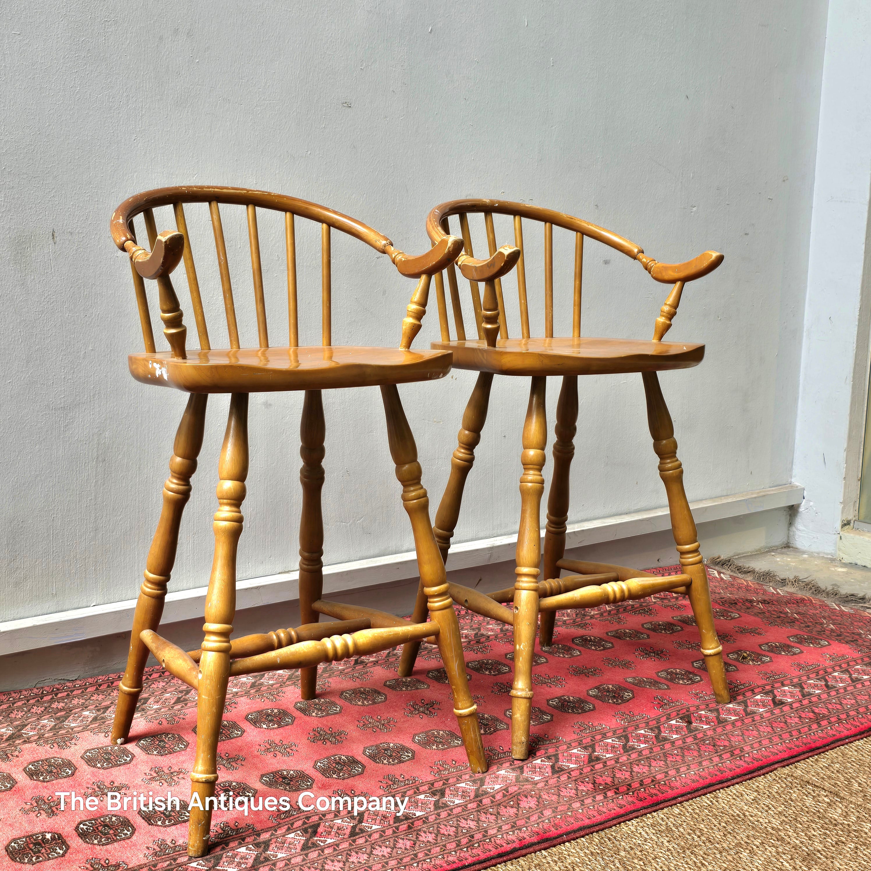 A PAIR OF HARDWOOD HIGH BACK KITCHEN STOOLS ON TURNED LEGS AND STRECHERS