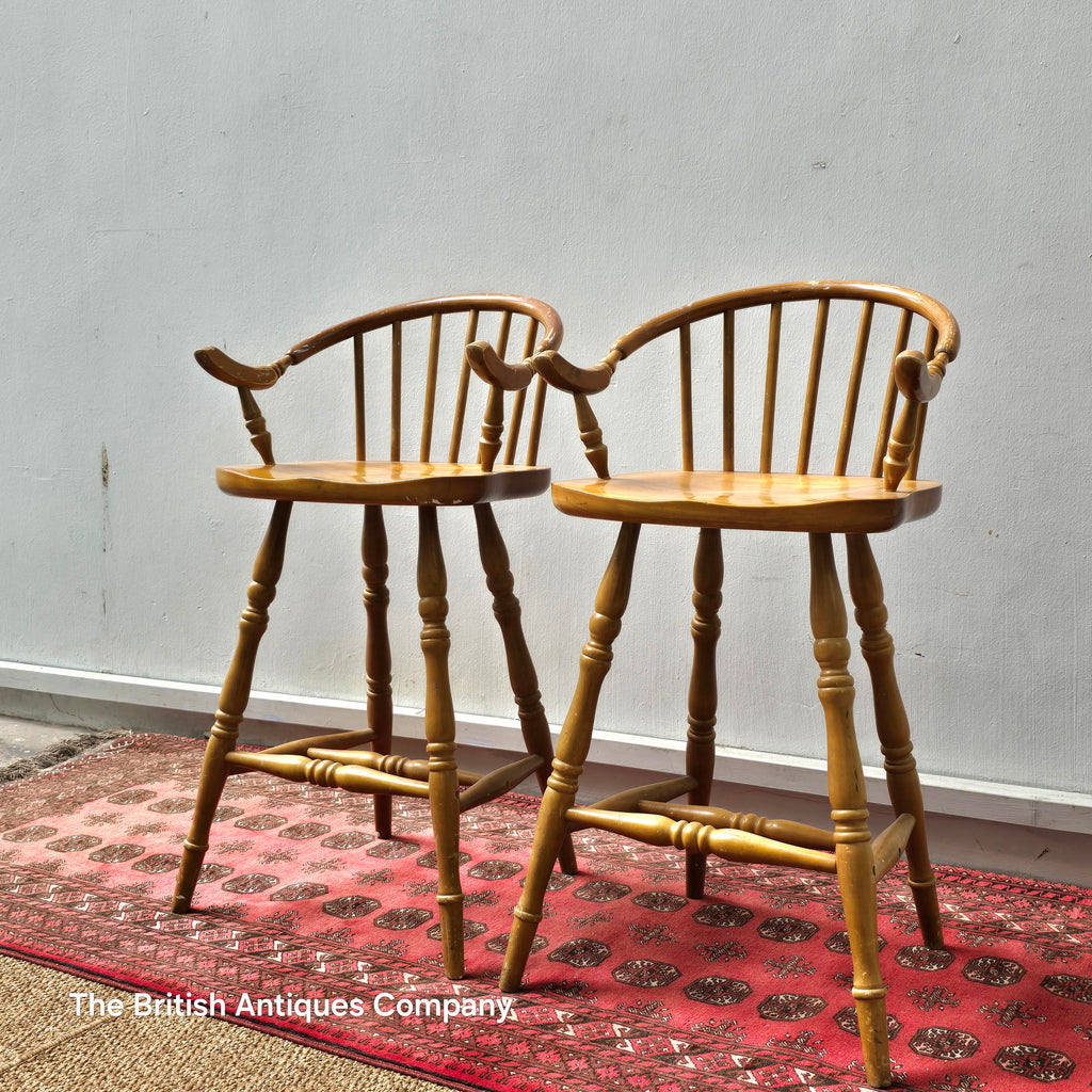 A PAIR OF HARDWOOD HIGH BACK KITCHEN STOOLS ON TURNED LEGS AND STRECHERS
