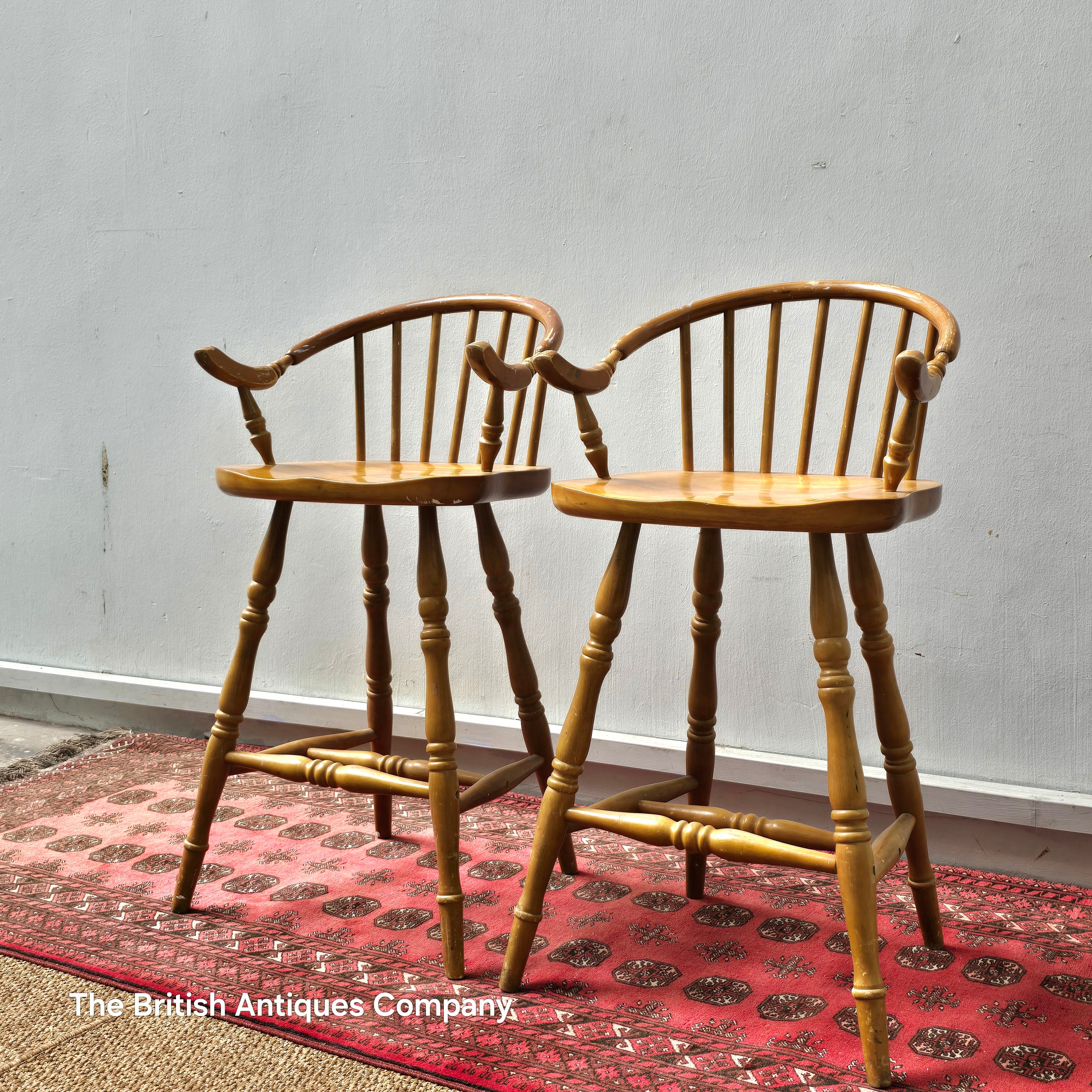 A PAIR OF HARDWOOD HIGH BACK KITCHEN STOOLS ON TURNED LEGS AND STRECHERS