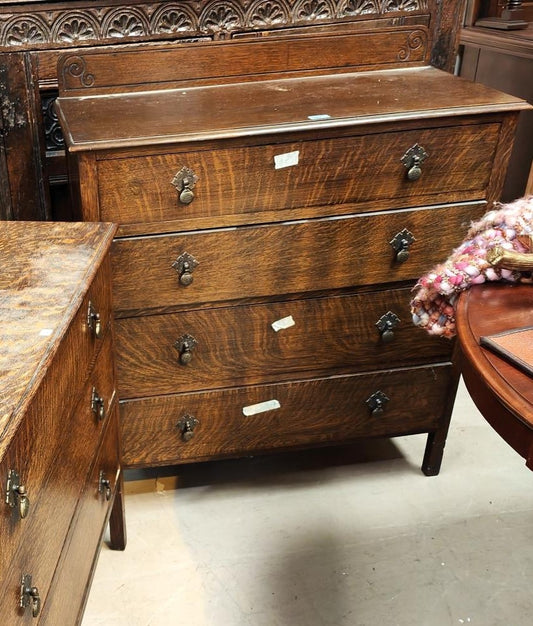 A 1930's Oak chest of 4 long drawers