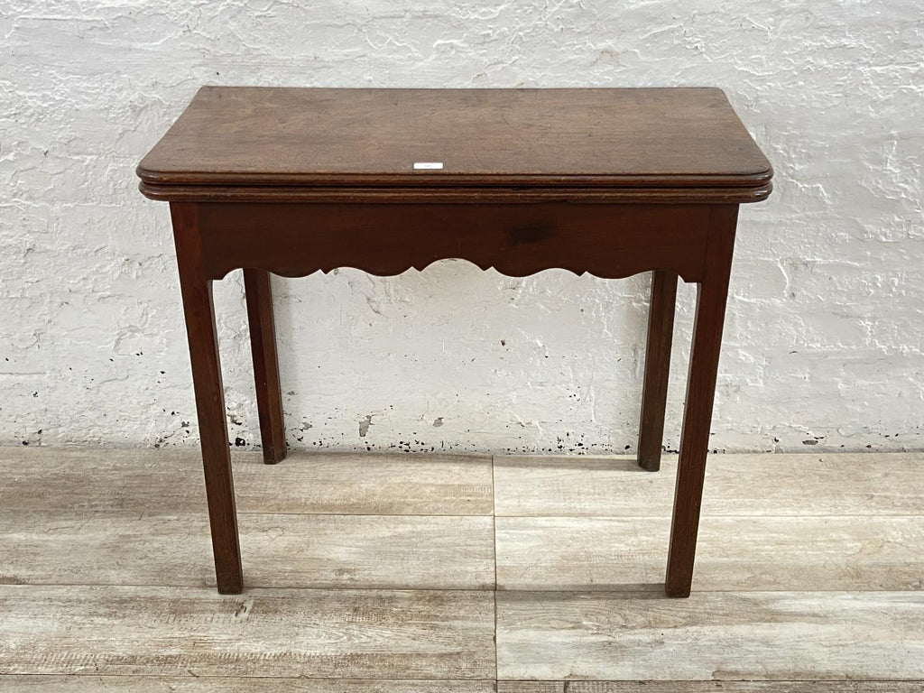 A George III mahogany fold over tea table - approx. 74cm high x 87cm wide x 42cm deep when closed