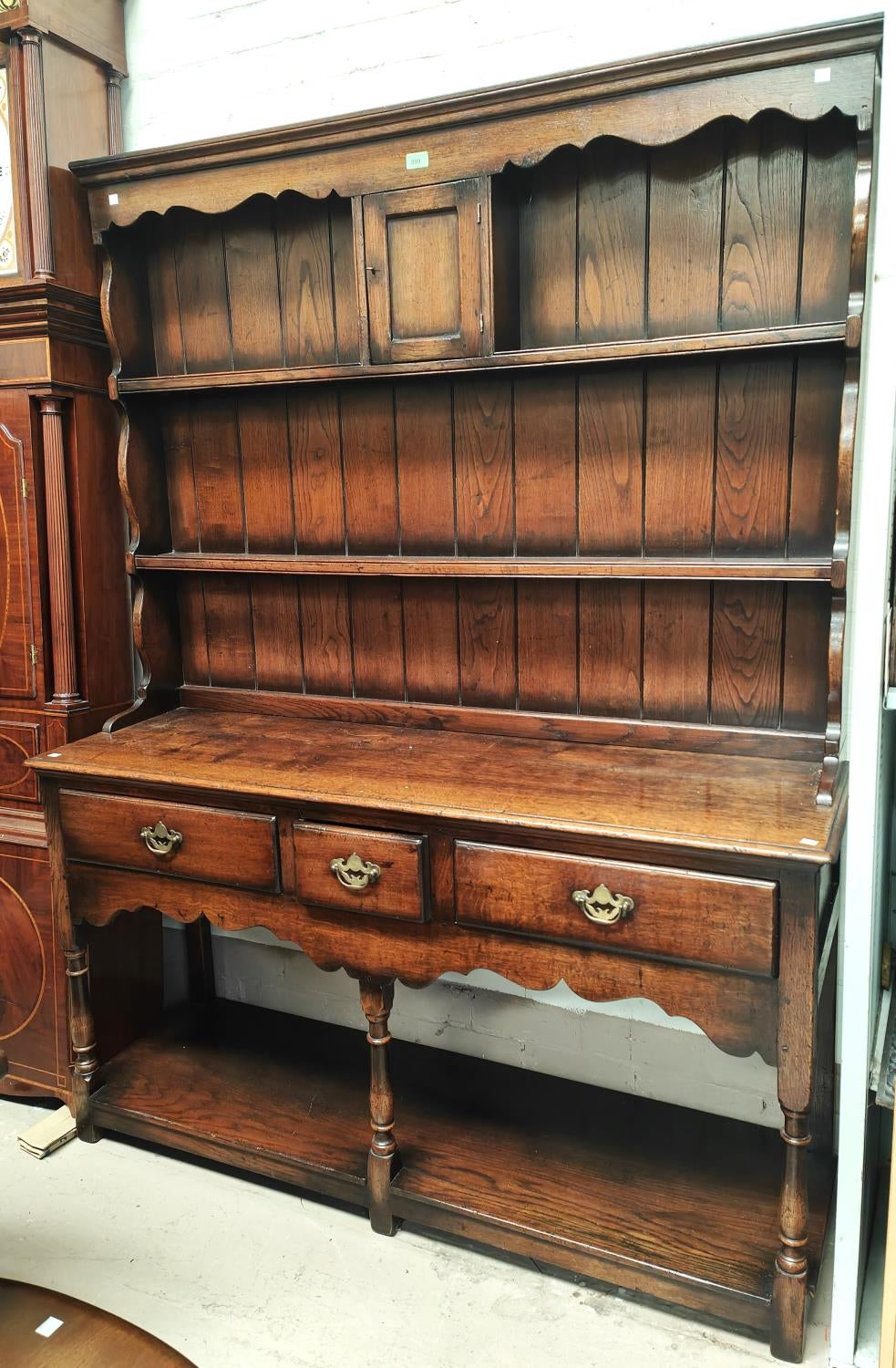 A Georgian style distressed oak Welsh dresser in the style of Titchmarsh and Goodwin
