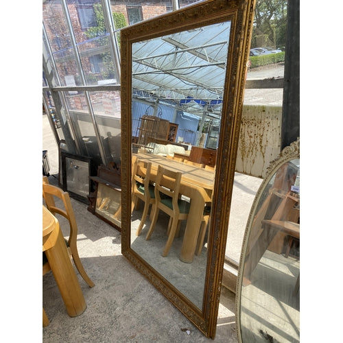 A RARE LARGE GILT FRAMED BEVEL EDGE WALL MIRROR, 72" X 42"