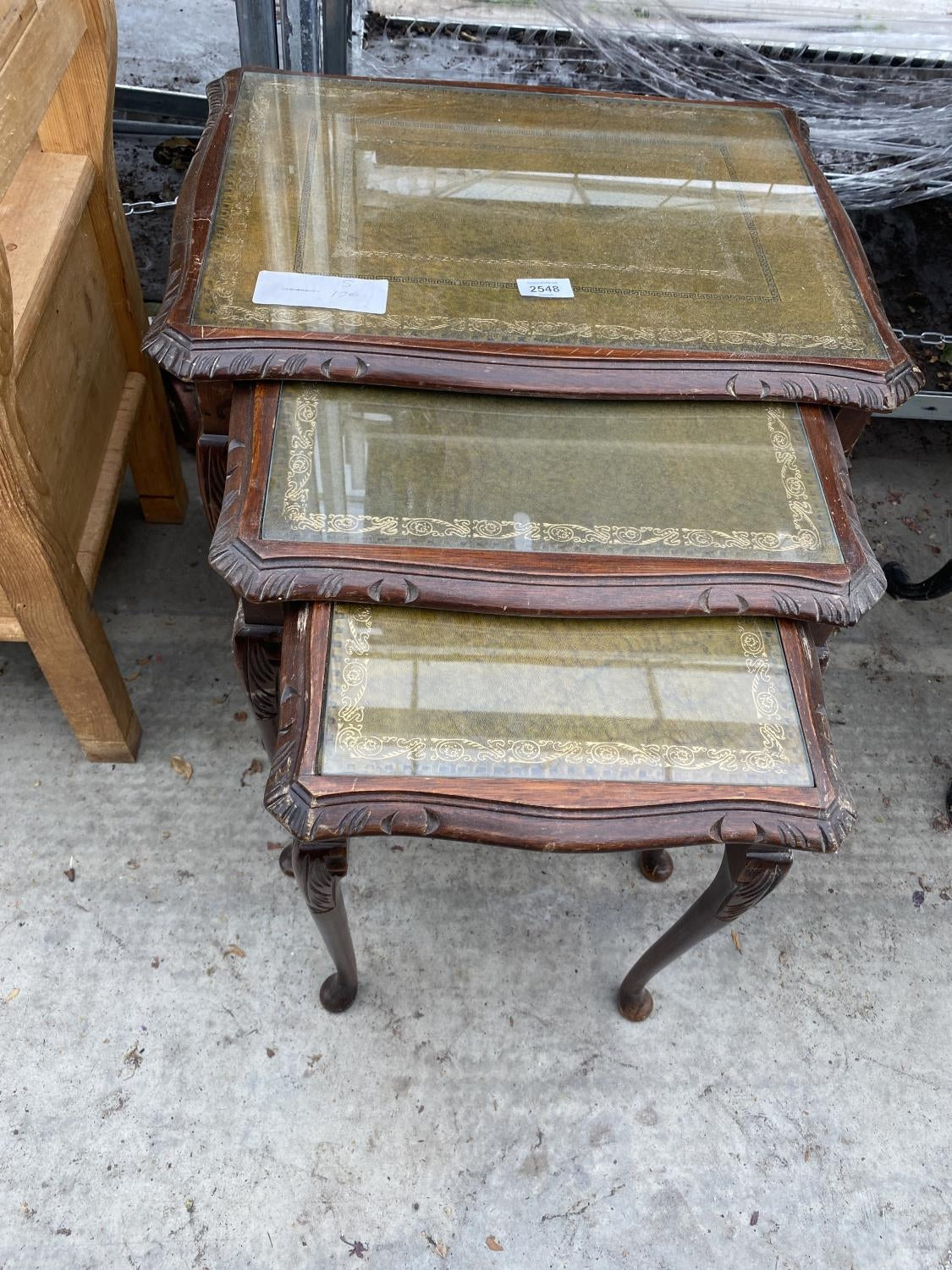 A  NEST OF THREE VINTAGE TABLES ON CABRIOLE LEGS