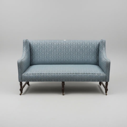 [Pre-Order]Edwardian English sofa, standing on turned mahogany legs, with sprung seat and shaped ands.  Circa 1910