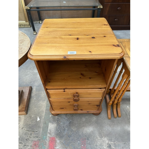 A PINE BEDSIDE CABINET WITH TWO DRAWERS