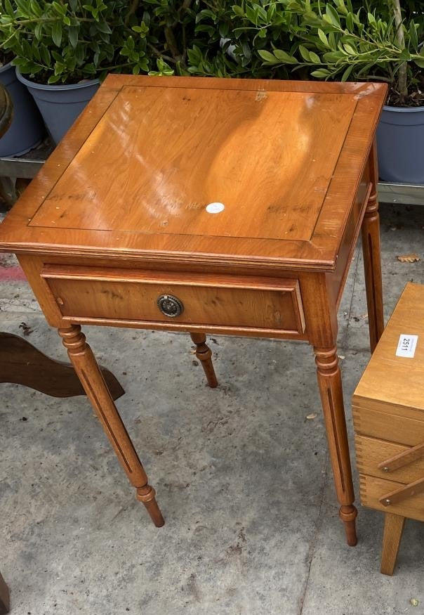 A YEW WOOD LAMP TABLE WITH SINGLE DRAWER