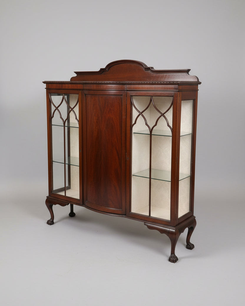 Wooden display cabinet with glass doors in a showroom setting
