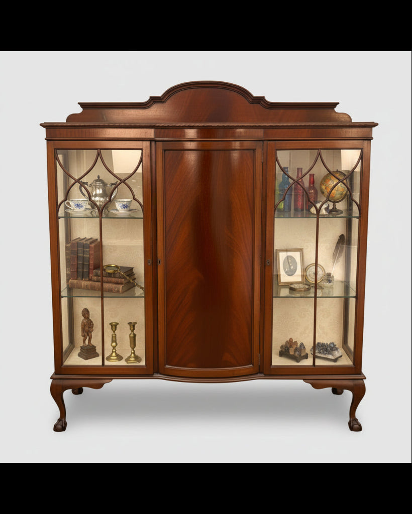 Wooden display cabinet with glass doors on a white background