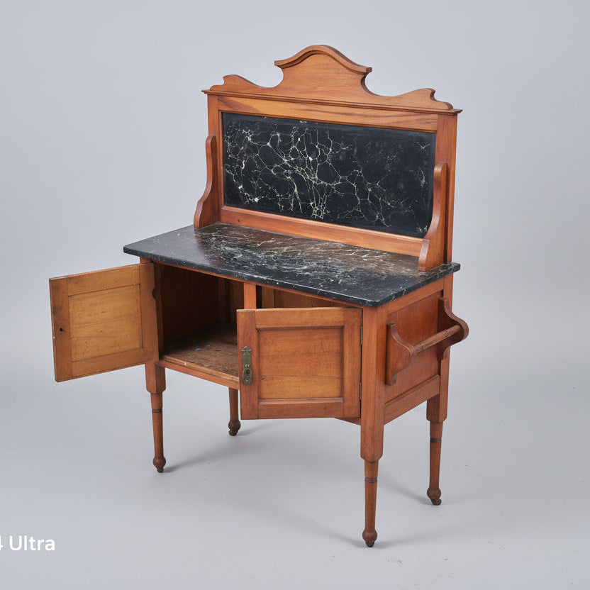 Wooden desk with marble top on a red patterned rug