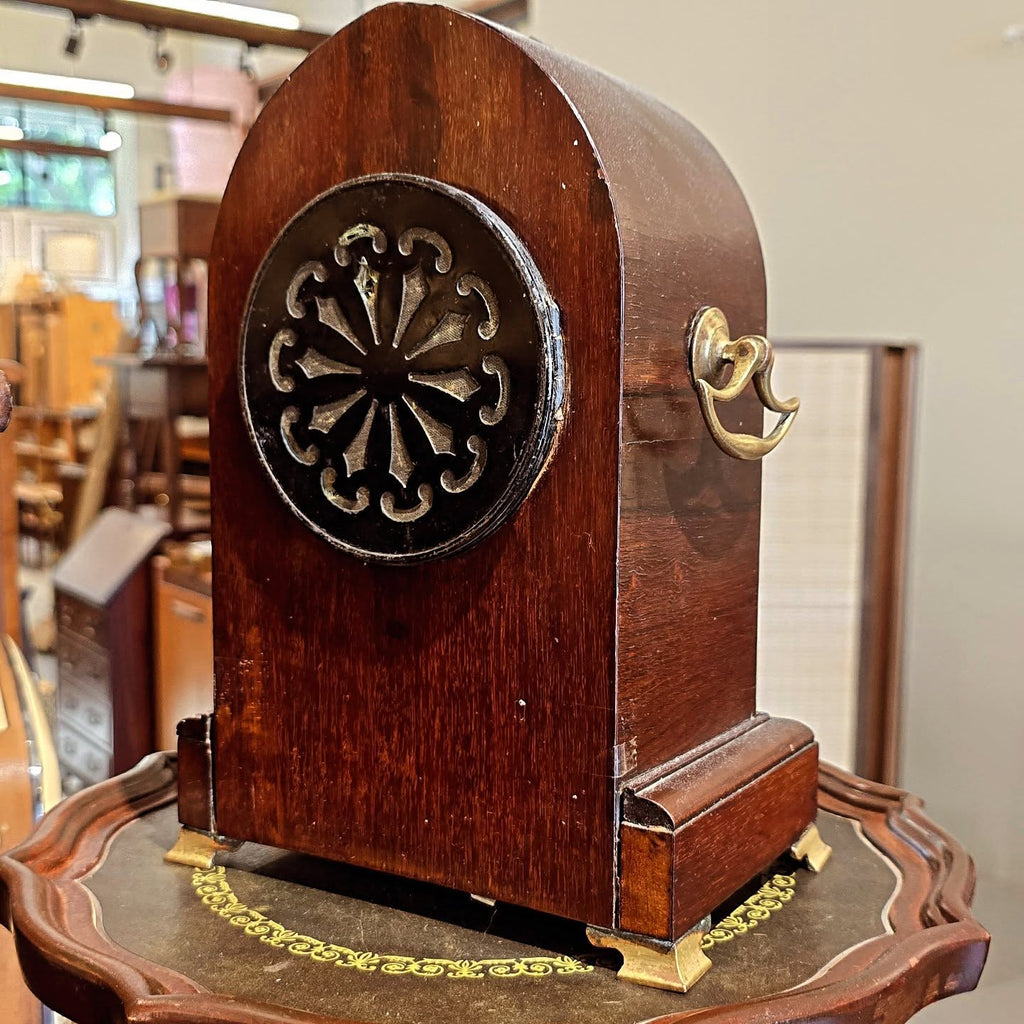 Regal Timepiece: Antique Mantle Clock on a Desk