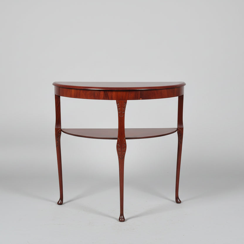 Wooden side table with two shelves on a gray background