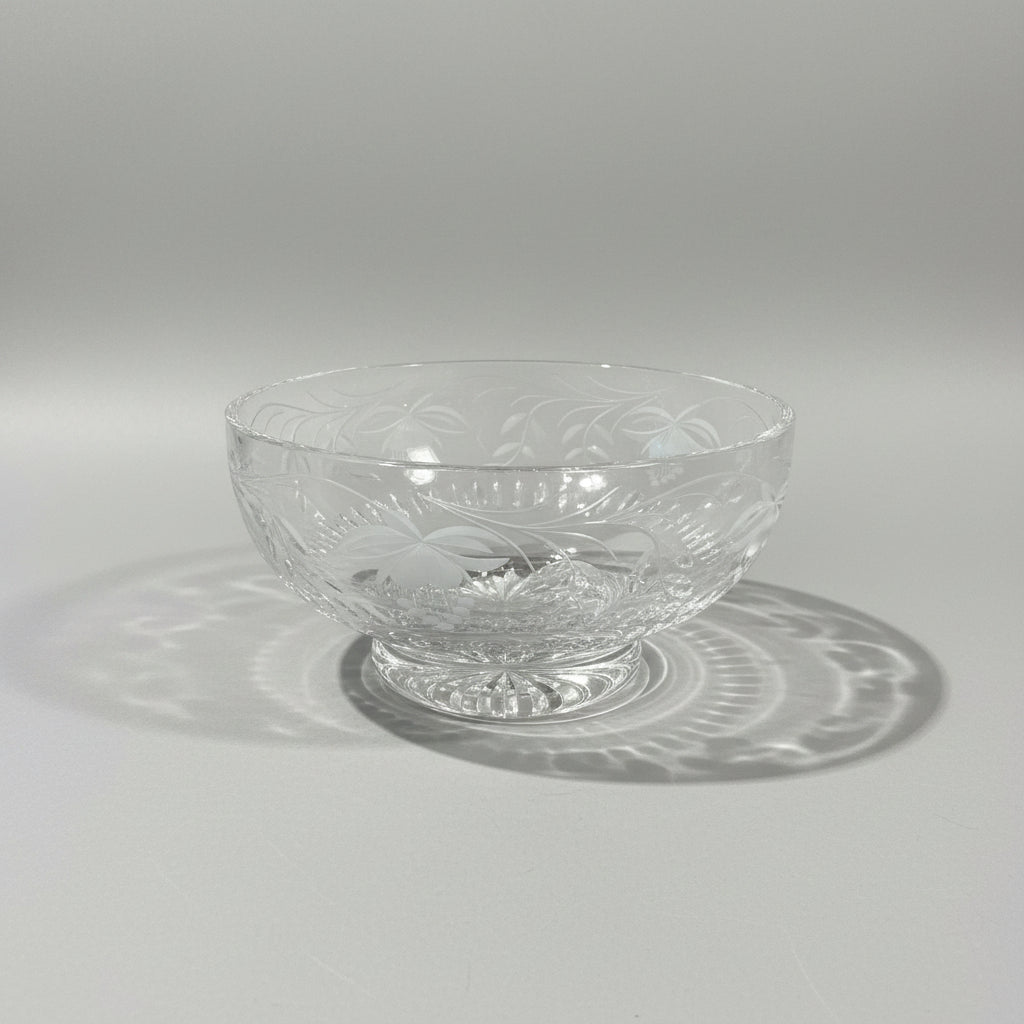 Clear crystal bowl with engraved design on a wooden table, labeled 'Royal Brierley Crystal Bowl'.