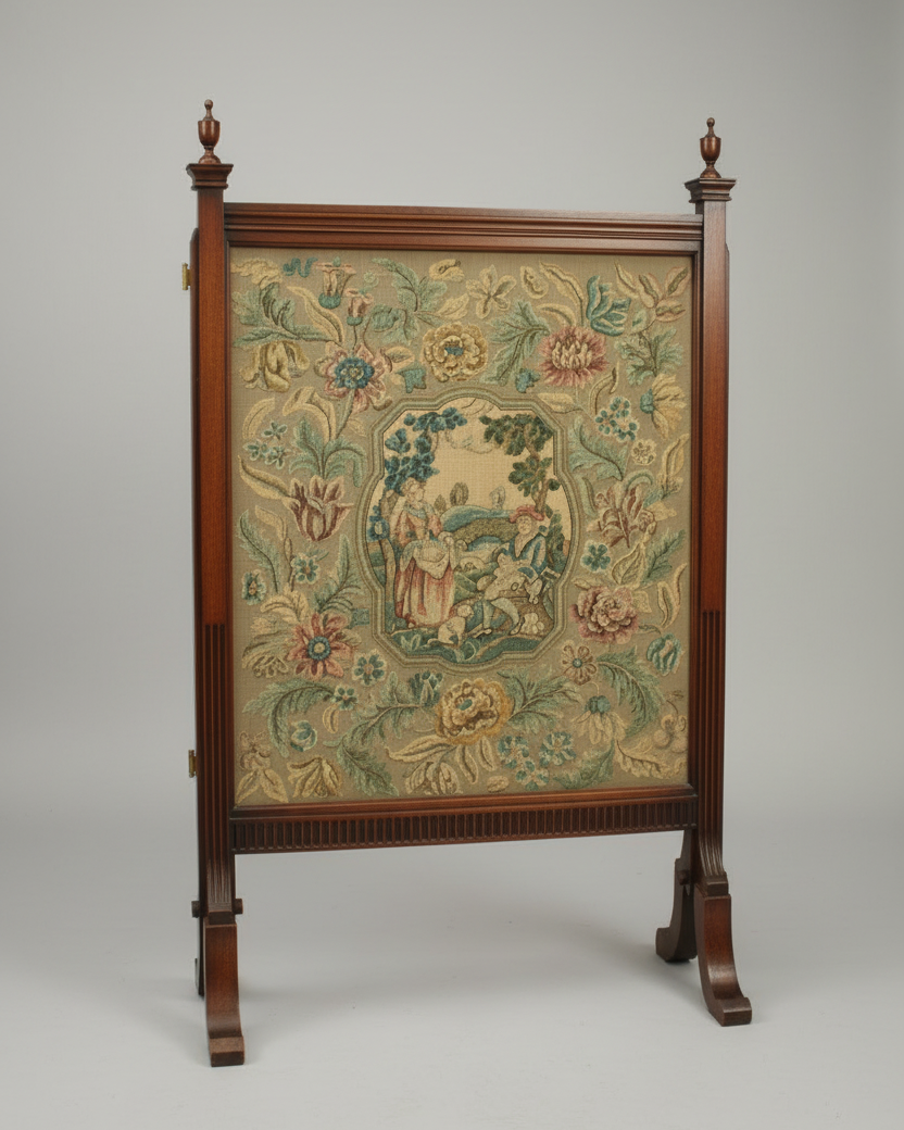 An antique wooden tapestry stand featuring a detailed floral and pastoral tapestry panel in the center, set against a neutral gray studio background.