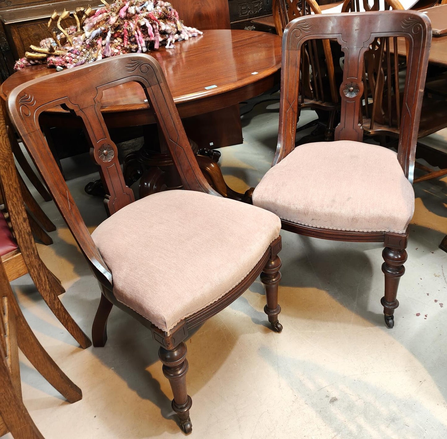 A set of 4 Victorian mahogany spoon back dining chairs with floral seats