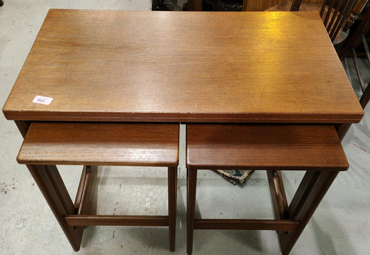 A set of three teak nesting tables manufactured by A H McIntosh  1970