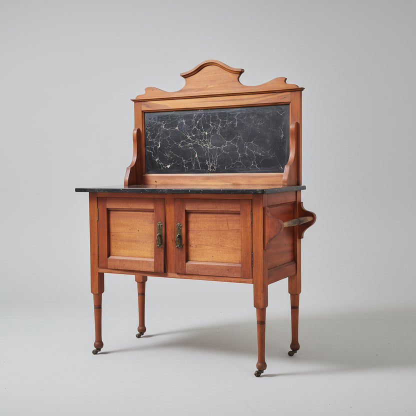 Wooden cabinet with a blackboard top on a red patterned rug