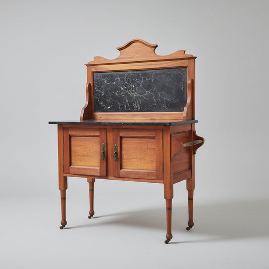 Wooden cabinet with a blackboard top on a red patterned rug