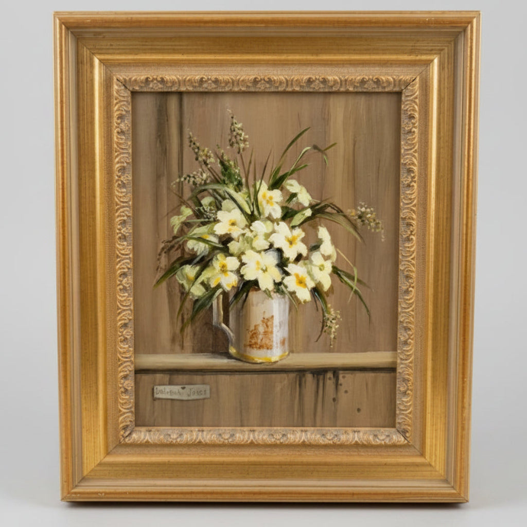 Framed artwork of a still life with flowers in a vase on a wooden surface.