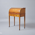 Wooden roll-top desk on a gray background