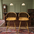 A PAIR OF HARDWOOD HIGH BACK KITCHEN STOOLS ON TURNED LEGS AND STRECHERS