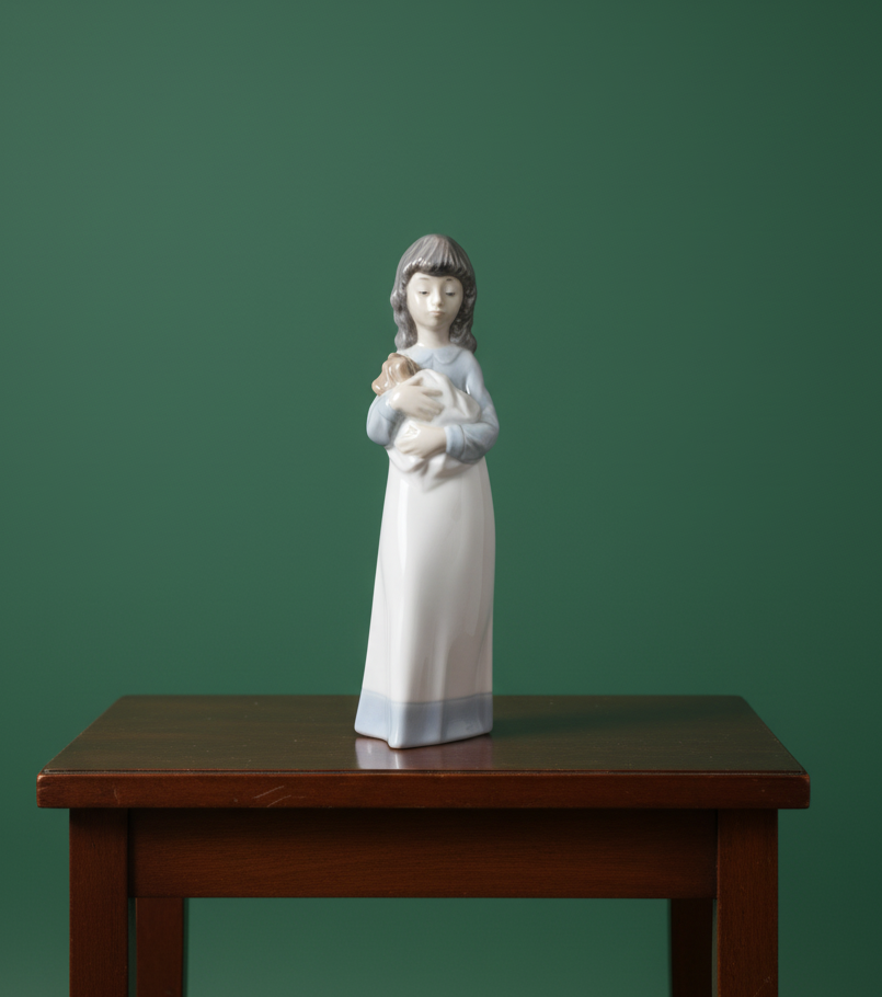 NAO by Lladro porcelain figurine of a girl holding a puppy