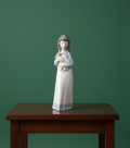 NAO by Lladro porcelain figurine of a girl holding a puppy