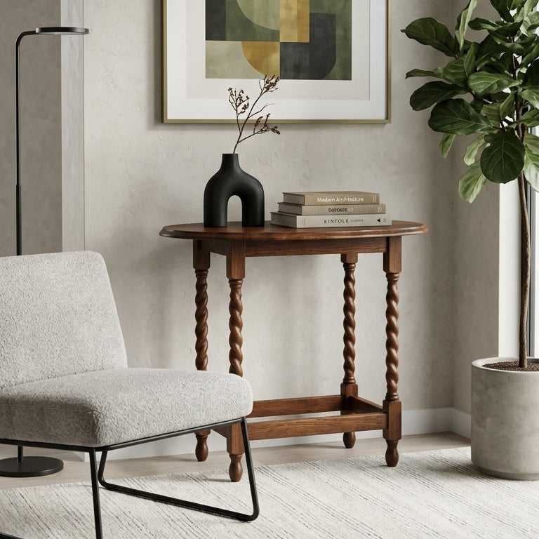 A framed abstract art print with geometric shapes in olive green, mustard yellow, and black, hanging on a textured beige wall above a wooden console table in a styled living room.