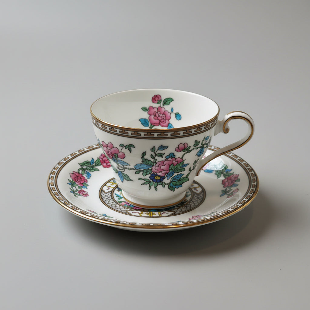Floral teacup and saucer set on a wooden table