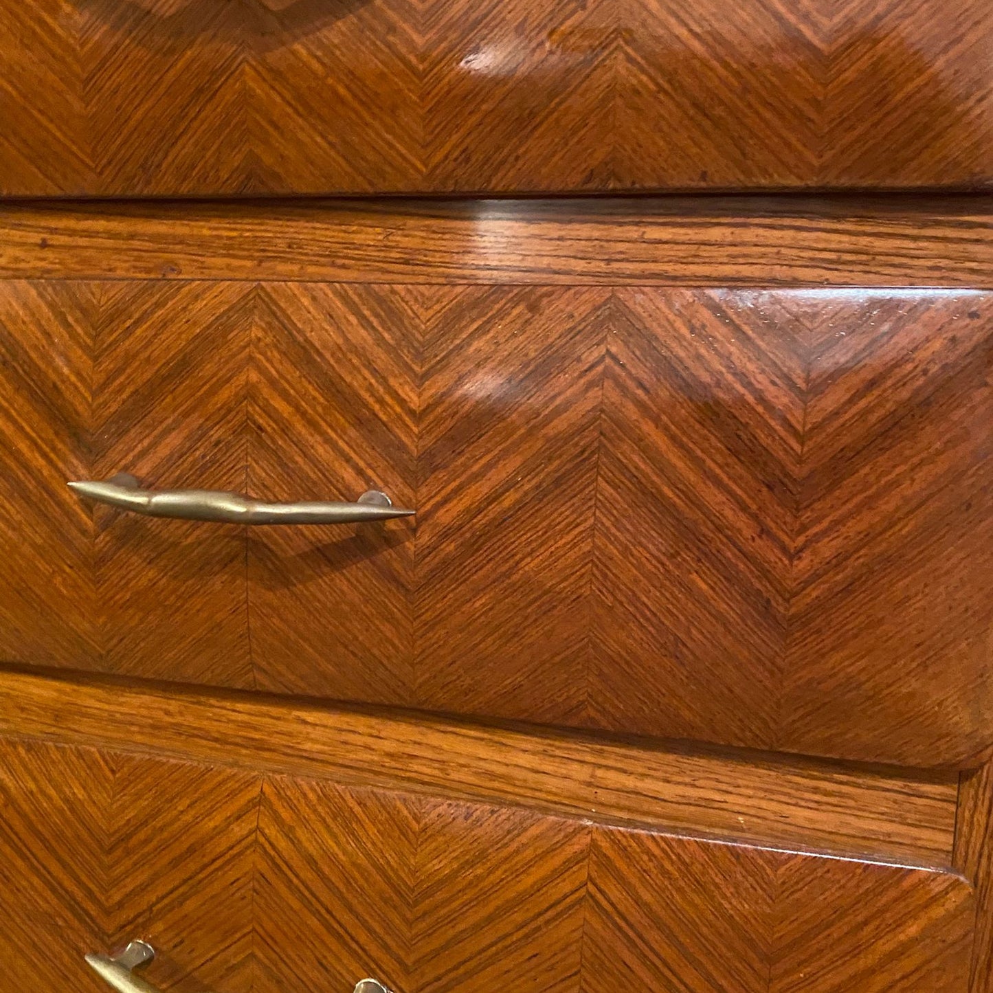 Wooden drawer with chevron pattern and gold handles